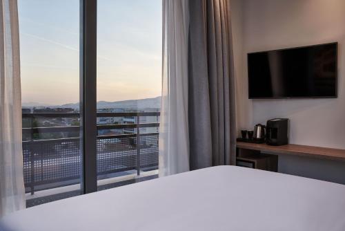 Suite con vistas a la Acrópolis del hotel NLH KERAMEIKOS - Neighborhood Lifestyle Hotels. Foto 1