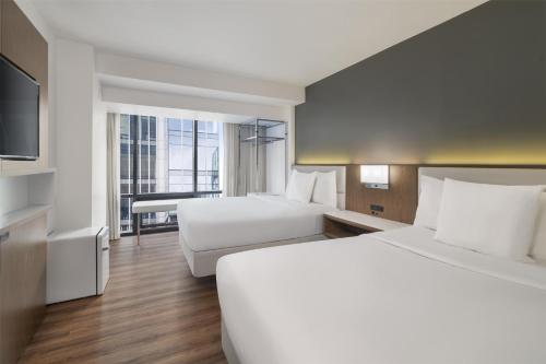 Habitación doble con 2 camas dobles adaptada para personas de movilidad reducida - No fumadores del hotel Best Western Premier Empire State