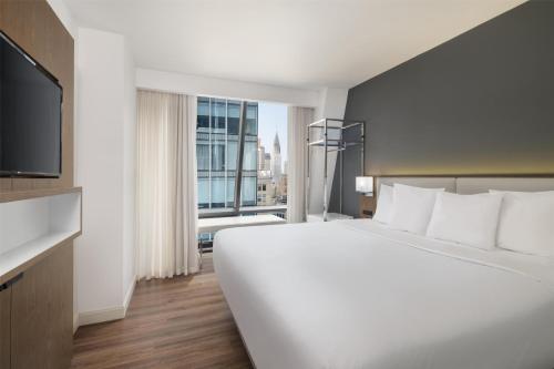 Habitación adaptada para personas de movilidad reducida con cama extragrande y ducha a ras de suelo - No fumadores del hotel Best Western Premier Empire State