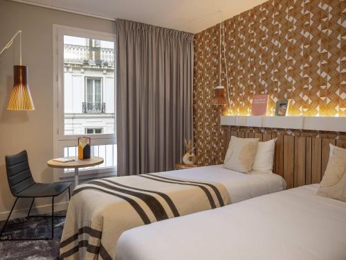 Habitación Doble Estándar - 2 camas del hotel Ibis Paris Gare Montparnasse Catalogne. Foto 4