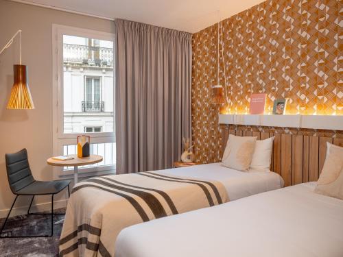 Habitación Doble Estándar - 2 camas del hotel Ibis Paris Gare Montparnasse Catalogne. Foto 9