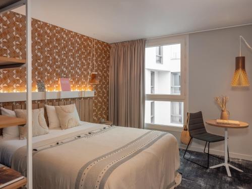 Habitación Doble Estándar del hotel Ibis Paris Gare Montparnasse Catalogne. Foto 9