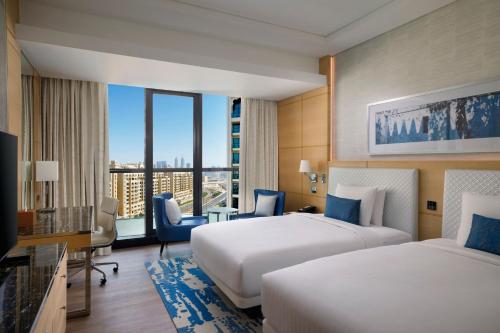 Palm Deluxe Room, 2 Double Beds, Private Balcony, Beachfront Resort del hotel Marriott Resort Palm Jumeirah Dubai. Foto 1