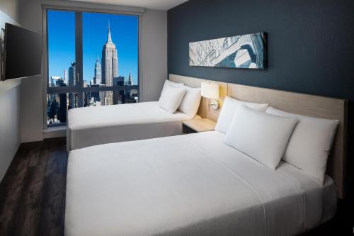 Habitación Doble con 2 camas dobles y vistas al perfil urbano del hotel Hyatt Place New York / Chelsea. Foto 8