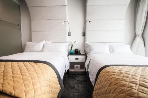 Habitación Premium - 2 camas dobles del hotel Wyndham Garden Brooklyn Sunset Park. Foto 3