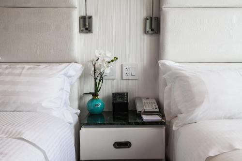 Habitación Cuádruple Superior del hotel Wyndham Garden Brooklyn Sunset Park. Foto 1