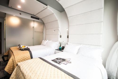 Habitación Cuádruple Superior del hotel Wyndham Garden Brooklyn Sunset Park. Foto 2