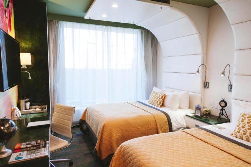 Habitación Cuádruple Deluxe del hotel Wyndham Garden Brooklyn Sunset Park. Foto 1