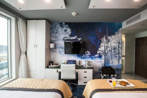 Habitación Cuádruple Deluxe del hotel Wyndham Garden Brooklyn Sunset Park. Foto 9