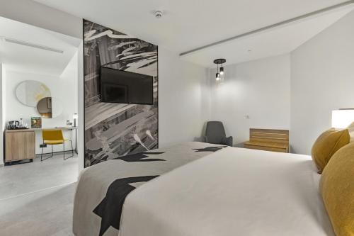Suite Junior Familiar con cama extragrande del hotel Riu Plaza London Victoria. Foto 2