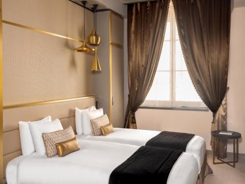 Habitación Doble Privilege - 2 camas del hotel Niepce Paris , Curio Collection By Hilton. Foto 1