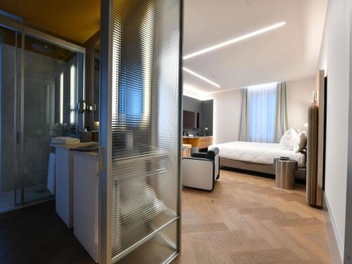 Habitación Deluxe del hotel Palazzo Tirso Cagliari Mgallery. Foto 1