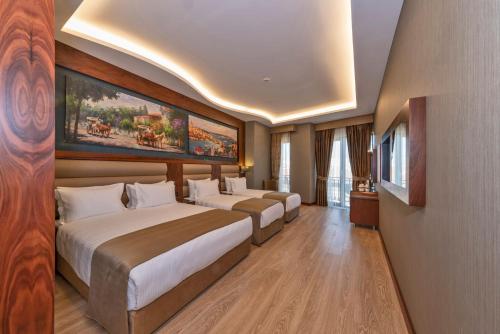 Habitación Triple Deluxe del hotel Piya Sport. Foto 2