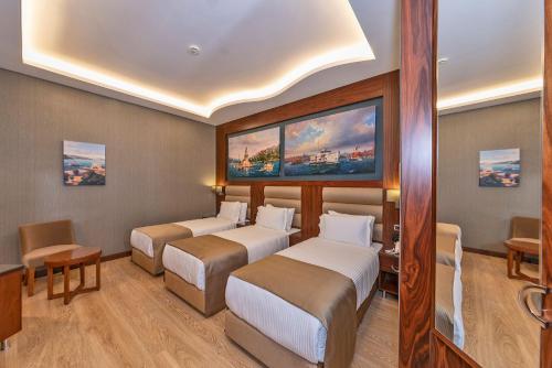 Habitación Triple Deluxe del hotel Piya Sport. Foto 7
