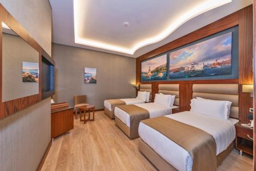 Habitación Triple Deluxe del hotel Piya Sport. Foto 9