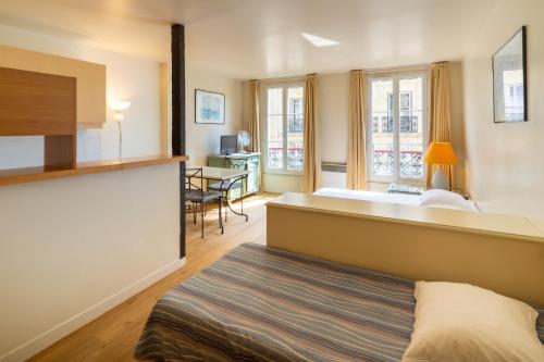 Apartamento Con Cocina Vista ciudad 2 sofás camas del hotel Capfun Le Saint Germain. Foto 1