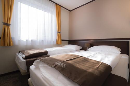 Habitación Doble Económica - 2 camas del hotel Toyoko Inn Frankfurt am Main Hauptbahnhof. Foto 4