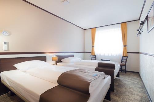 Habitación Doble - 2 camas del hotel Toyoko Inn Frankfurt am Main Hauptbahnhof. Foto 4