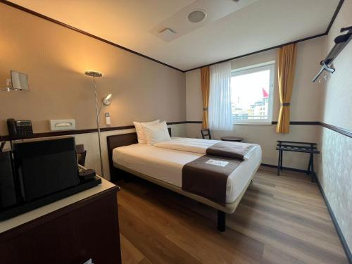 Habitación Individual Deluxe del hotel Toyoko Inn Frankfurt am Main Hauptbahnhof. Foto 2