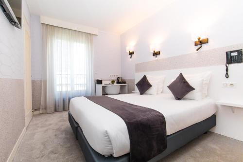 Habitación Doble Superior con vistas a la ciudad del hotel De Paris Montparnasse