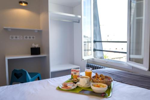 Habitación Individual con vistas al jardín del hotel De Paris Montparnasse. Foto 3