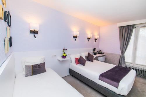 Habitación Triple del hotel De Paris Montparnasse. Foto 3