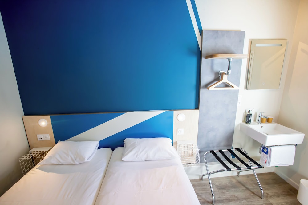 Habitación con 2 camas individuales para hasta 2 personas del hotel Ibis budget Haguenau Strasbourg Nord. Foto 8