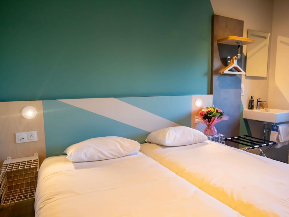Habitación con 2 camas individuales para hasta 2 personas del hotel Ibis budget Haguenau Strasbourg Nord. Foto 13