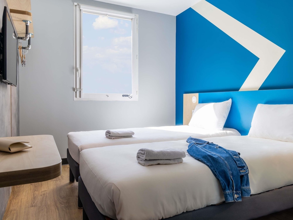 Habitación con dos camas individuales del hotel ibis budget Chatillon Paris Ouest
