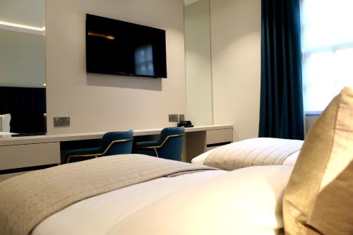 Estudio con 2 camas individuales del hotel NOX Waterloo