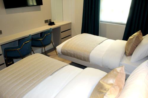 Estudio con 2 camas individuales del hotel NOX Waterloo. Foto 1