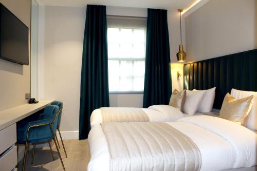 Estudio con 2 camas individuales del hotel NOX Waterloo. Foto 6