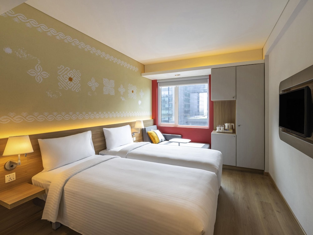 Habitación estándar con 2 camas individuales del hotel Ibis Mumbai Vikhroli. Foto 4