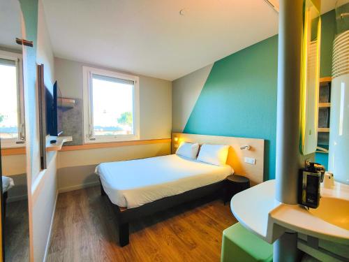 Doble - Habitación con cama grande del hotel Ibis Budget Rodez. Foto 5