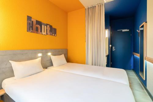 Habitación Doble Estándar - 2 camas del hotel ibis budget Genève Aéroport. Foto 3