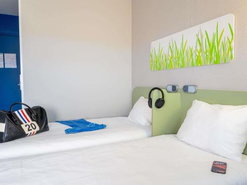 GEMELA - habitación con dos camas individuales para hasta 2 personas del hotel Ibis Budget Rouen Parc Des Expos Zenith. Foto 4