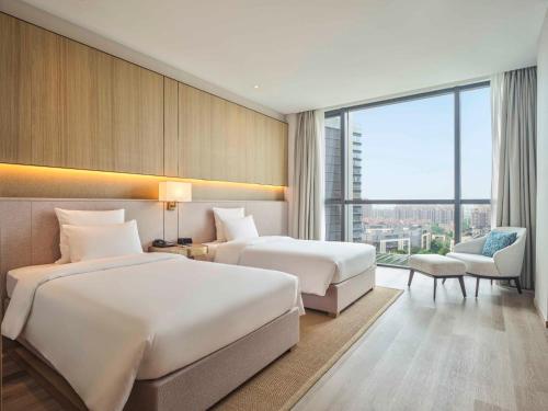 Habitación superior con 2 camas individuales del hotel Novotel Shanghai Qingpu Excellence