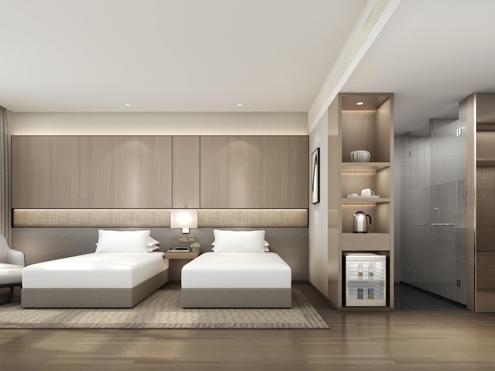 Habitación estándar con 2 camas individuales del hotel Novotel Shanghai Qingpu Excellence. Foto 3