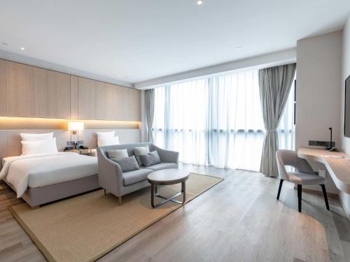 Habitación superior con 2 camas individuales del hotel Novotel Shanghai Qingpu Excellence. Foto 2