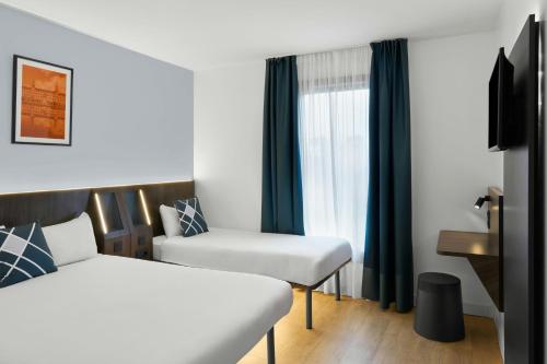 Habitación Triple Estándar del hotel Four Points Flex by Sheraton Madrid Atocha