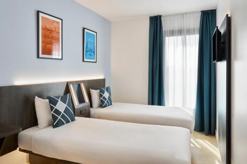 Habitación Doble Estándar - 2 camas del hotel Four Points Flex by Sheraton Madrid Atocha. Foto 9