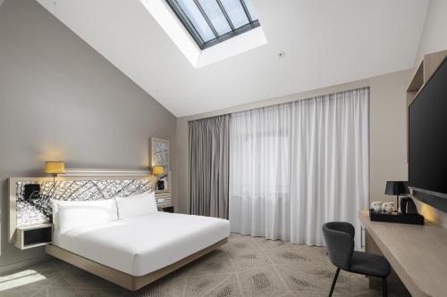Deluxe King Skylight Room del hotel Hilton Garden Inn Paris La Villette