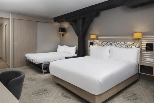 Habitación Doble Deluxe con sofá cama del hotel Hilton Garden Inn Paris La Villette