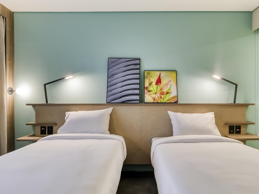 Habitación superior con 2 camas individuales del hotel Novotel Belo Horizonte Savassi. Foto 2