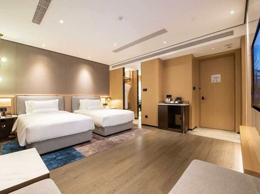 Habitación Superior con Dos Camas Individuales del hotel Novotel Tianjin Drum Tower. Foto 1