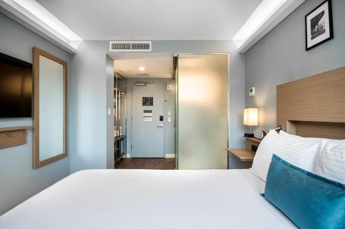 Habitación Deluxe - Cama grande - No Fumadores del hotel Wingate By Wyndham Bronx/haven Park. Foto 11