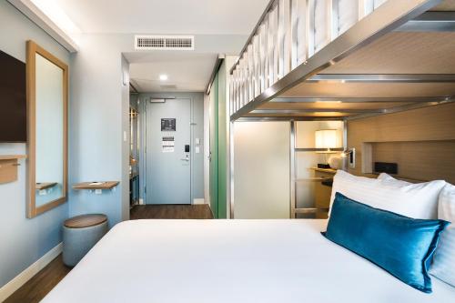 Habitación Deluxe con 1 cama grande y 1 litera individual - No fumadores del hotel Wingate By Wyndham Bronx/haven Park. Foto 8