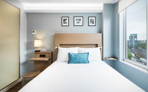 Habitación Deluxe - Cama grande - No Fumadores del hotel Wingate By Wyndham Bronx/haven Park. Foto 7