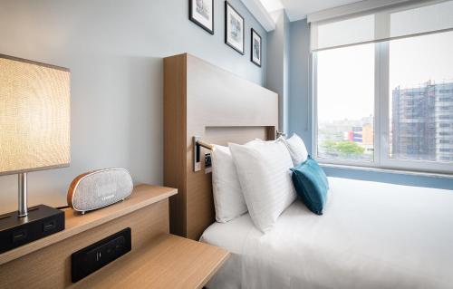 Habitación Deluxe - Cama grande - No Fumadores del hotel Wingate By Wyndham Bronx/haven Park. Foto 9