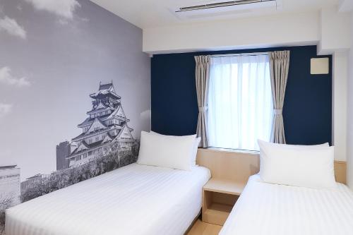 Habitación Doble Deluxe - 2 camas del hotel Travelodge Honmachi Osaka. Foto 1